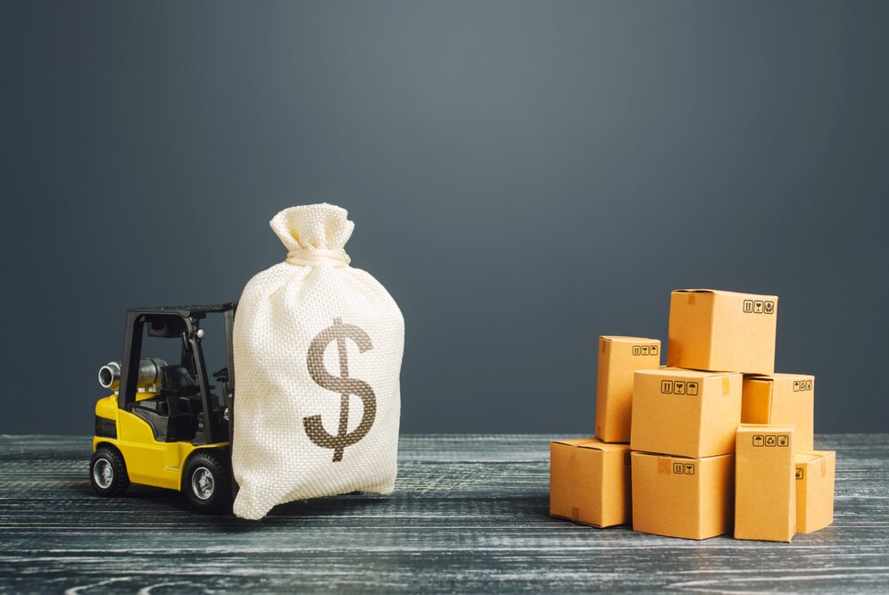 forklift carrying money towards a pile of boxes