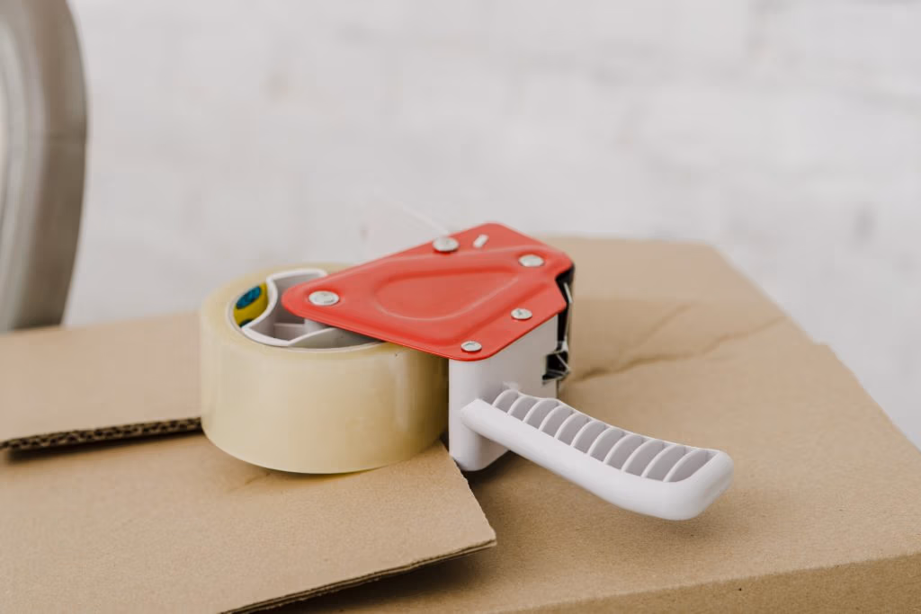 Roll of tape on dispenser
