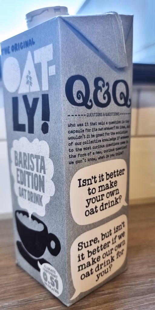 side view of oatly oat drink carton