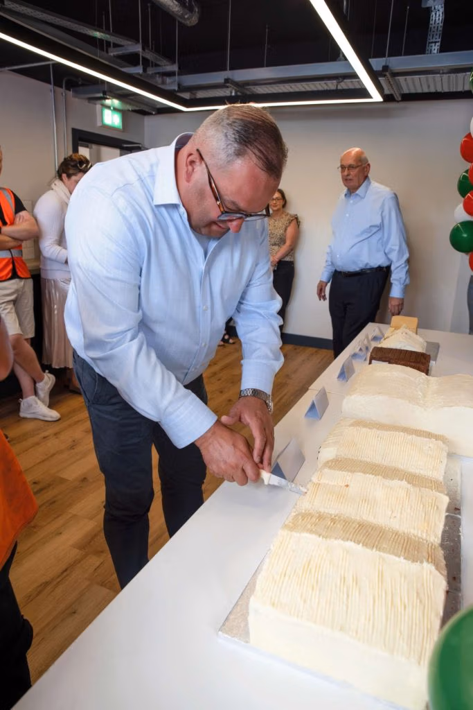 Jerry Francis Cutting Celebration Cake