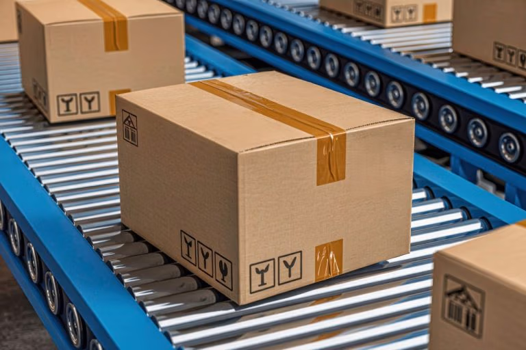 Image of package on metal roller conveyer without labels